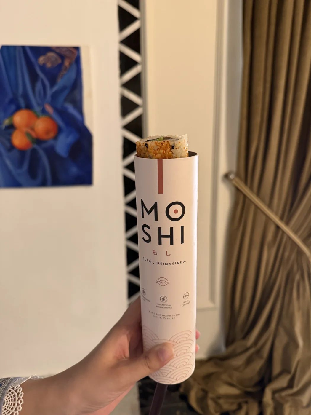 A real MOSHI push-pop with sushi emerging from the tube